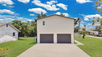 **SHORT SALE!** Light-filled corner home on the Caloosahatchee