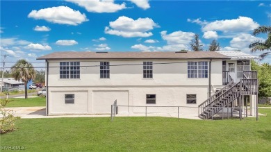 **SHORT SALE!** Light-filled corner home on the Caloosahatchee