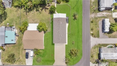 **SHORT SALE!** Light-filled corner home on the Caloosahatchee