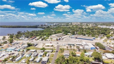 **SHORT SALE!** Light-filled corner home on the Caloosahatchee