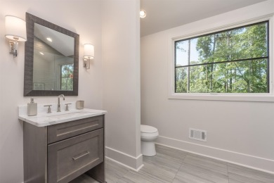 You'll find classic elegance in this transitional-style lake