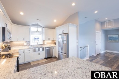 Nestled in the serene Corolla Bay community, 1024 Cruz Bay Lane