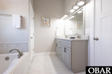 Nestled in the serene Corolla Bay community, 1024 Cruz Bay Lane