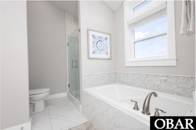 Nestled in the serene Corolla Bay community, 1024 Cruz Bay Lane