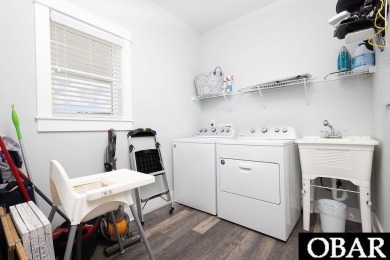 Nestled in the serene Corolla Bay community, 1024 Cruz Bay Lane