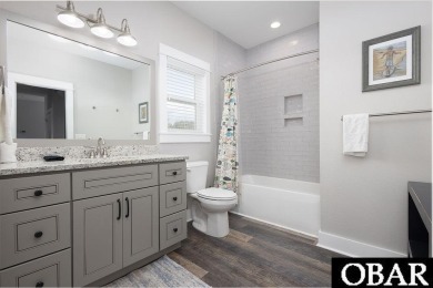 Nestled in the serene Corolla Bay community, 1024 Cruz Bay Lane