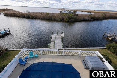 Nestled in the serene Corolla Bay community, 1024 Cruz Bay Lane