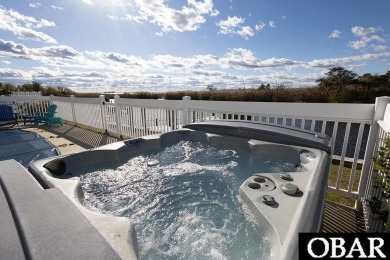 Nestled in the serene Corolla Bay community, 1024 Cruz Bay Lane