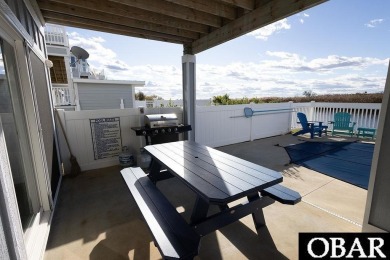 Nestled in the serene Corolla Bay community, 1024 Cruz Bay Lane