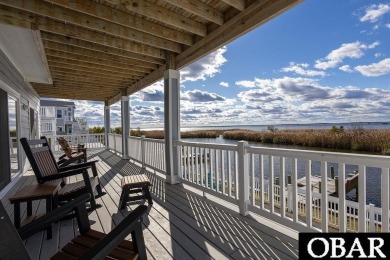 Nestled in the serene Corolla Bay community, 1024 Cruz Bay Lane