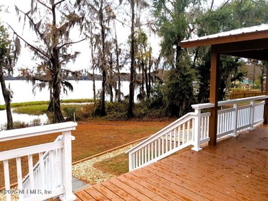 Water-lover's paradise! This lake home oasis is off the beaten