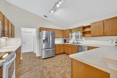 This exceptional home offers stunning views of the golf course