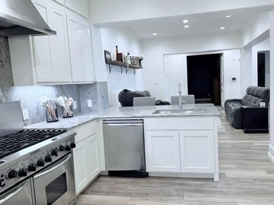 Welcome to refined luxury living nestled within the prestigious