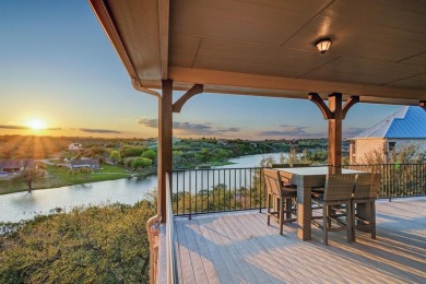 Come see this custom waterfront home that sits high on the hill