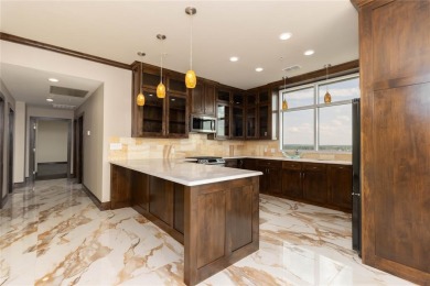 Experience luxury high-rise living in this stunning 4-bedroom