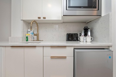 This charming bay facing studio condo, situated in the heart of