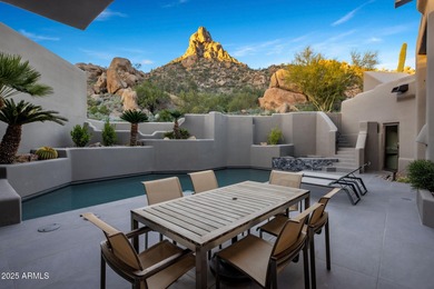 Situated in Desert Highlands coveted Hillside Villas, this