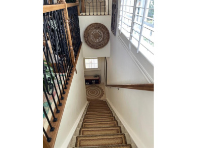 Stunning 3-story corner townhouse with private elevator in