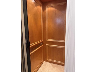 Stunning 3-story corner townhouse with private elevator in