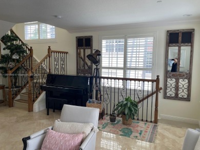 Stunning 3-story corner townhouse with private elevator in