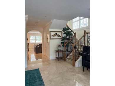 Stunning 3-story corner townhouse with private elevator in