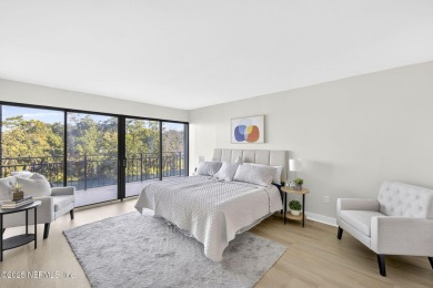 Gated high rise living on the St Johns River! Wake up to