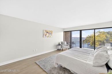 Gated high rise living on the St Johns River! Wake up to