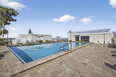 Gated high rise living on the St Johns River! Wake up to