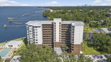 Gated high rise living on the St Johns River! Wake up to