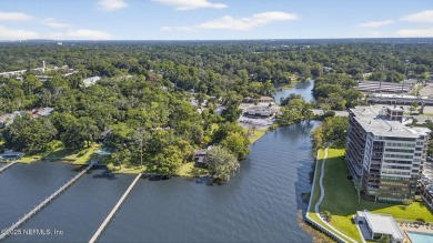 Gated high rise living on the St Johns River! Wake up to