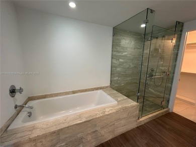 LOCATION, LOCATION, LOCATION. Beautiful 1 + den, 2 bath corner