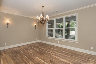 This stunning 4-bedroom, 4-bath home offers a refined living