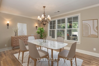 This stunning 4-bedroom, 4-bath home offers a refined living