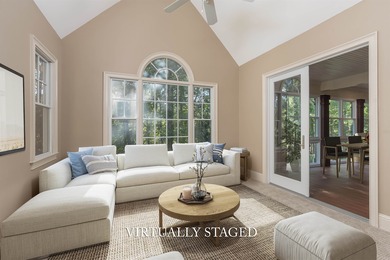 This stunning 4-bedroom, 4-bath home offers a refined living