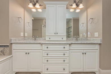 This stunning 4-bedroom, 4-bath home offers a refined living