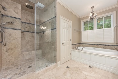 This stunning 4-bedroom, 4-bath home offers a refined living