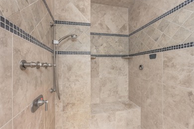 This stunning 4-bedroom, 4-bath home offers a refined living