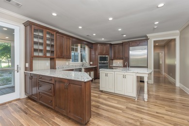 This stunning 4-bedroom, 4-bath home offers a refined living