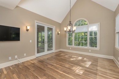 This stunning 4-bedroom, 4-bath home offers a refined living