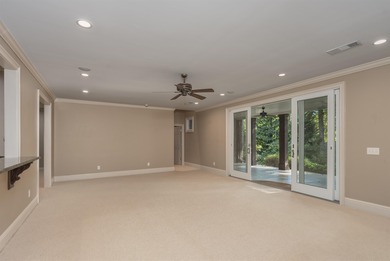 This stunning 4-bedroom, 4-bath home offers a refined living