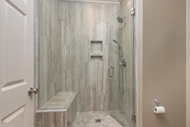 This stunning 4-bedroom, 4-bath home offers a refined living