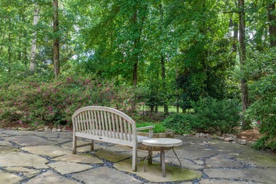 This stunning 4-bedroom, 4-bath home offers a refined living