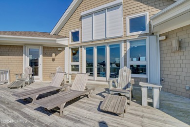 This is a beautifully maintained four-bedroom, five-bathroom