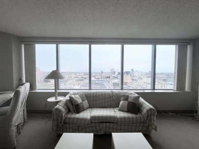 Spacious 1-bedroom high-rise condo with large windows in both