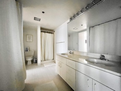 Spacious 1-bedroom high-rise condo with large windows in both