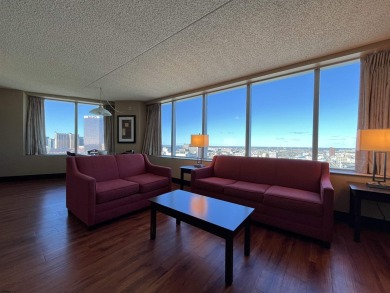 Bright and airy 1-bedroom condo in a high-rise, featuring
