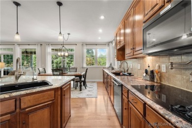 Immaculate home in a highly sought-after subdivision with lake