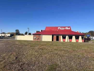 Commercial building and land on busy US 2 across from the