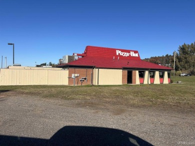 Commercial building and land on busy US 2 across from the