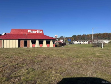 Commercial building and land on busy US 2 across from the